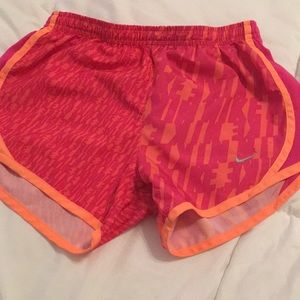 Orange and pink nike running shorts